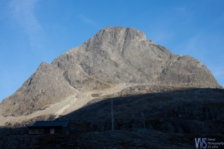 A massive mountain towers above the Trollstigen mountain road.